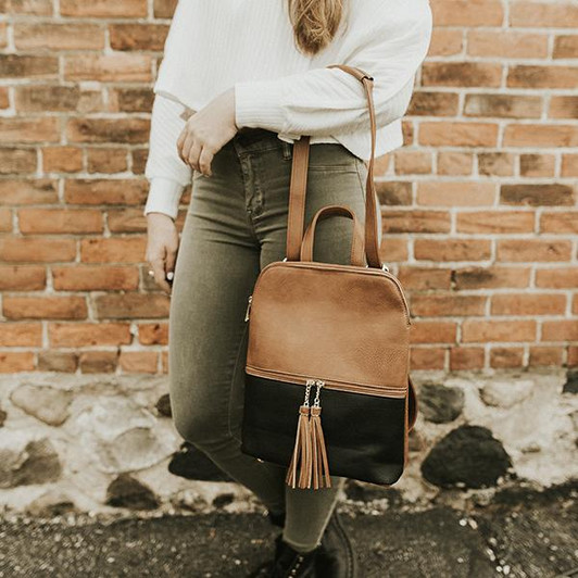 K-Carroll Scarlett Backpack shown being carried on arm of model