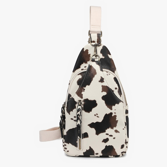 Jen & Co Nikki Dual Compartment Sling Pack Bag in cow print