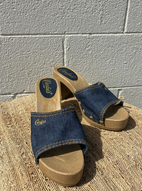 A true throwback piece, these slides feature a denim upper and solid wooden sole for a classic vintage look.