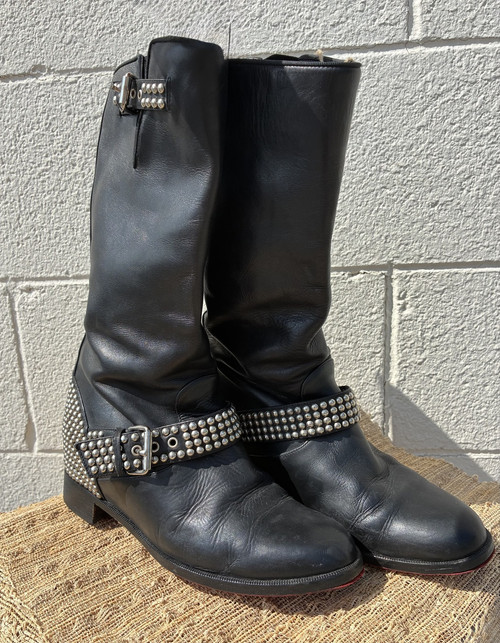 Sleek leather construction meets signature studded hardware for a fierce, moto-inspired silhouette. A true designer statement boot that pairs well with jeans, leggings, or a mini skirt!