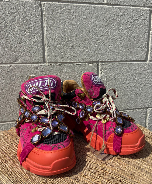 Iconic platform sneaker featuring Gucci's signature hiking-inspired chunky sole and bold branded logo. A designer statement shoe that instantly elevates any outfit!