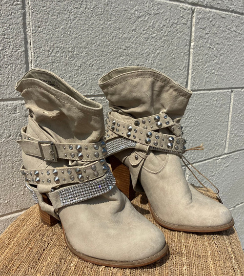 Studded hardware and rhinestones cover these beautiful tan boots, finished with a moto-inspired harness strap for extra edge. A true statement piece for anyone who likes their footwear bold and unforgettable!