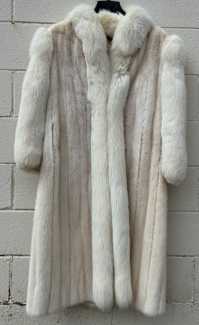 An extraordinary full-length coat blending luxurious white mink with plush white fox trim. A true rare find for serious vintage fur collectors, the kind of statement piece that elevates any outfit to old Hollywood glamour!