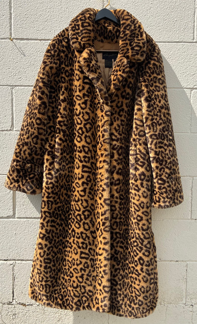 A bold leopard print faux fur maxi coat from designer Dennis Basso. Luxurious texture and eye-catching pattern make this a true statement outerwear piece. Perfect for elevating any winter outfit with a touch of glamour and animal-print edge.