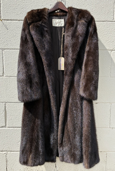 A beautifully crafted full-length mink coat from Stevens Furs. An elegant statement piece for fur collectors or anyone drawn to old-world luxury!