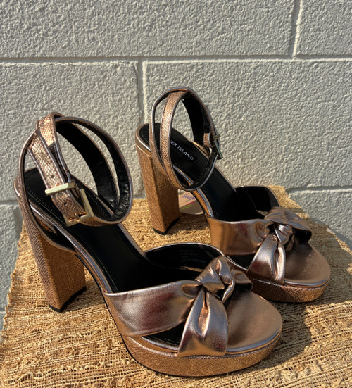 A striking metallic gold and rose gold finish gives these heels serious statement-piece appeal. Sleek and eye-catching, they're the perfect shoe to elevate any outfit, from a night out to a special occasion.