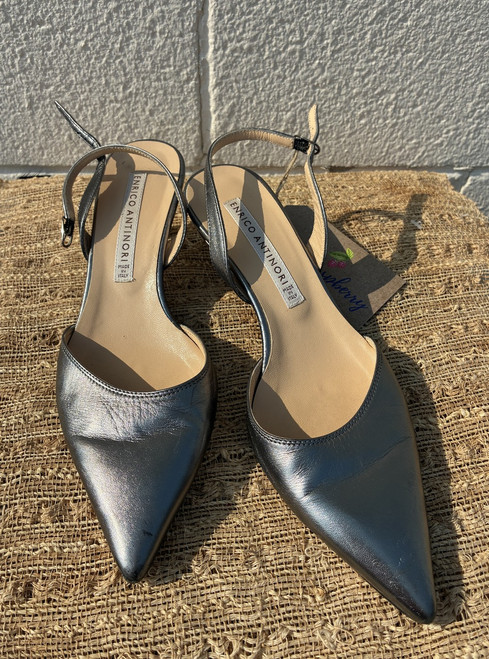 A sleek metallic finish and classic slingback silhouette come together on these Italian-made kitten heels. Elegant and versatile, they're perfect for the office, a wedding, or dressing up any everyday outfit.