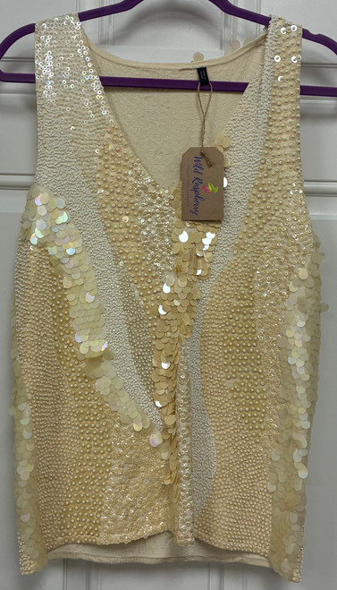 A creamy ivory tank is covered in delicate sequins and beading for a subtle, all-over shimmer. Elegant yet easy to wear, it's perfect for dressing up jeans for a night out or pairing with a skirt for a special occasion.