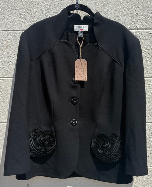A classic black wool jacket from Parisian designer Claude Bert, offering timeless tailoring and rich, warm fabric. A refined vintage piece perfect for elevating any fall or winter outfit with understated European elegance.