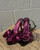 With a playful metallic magenta and black design and a fierce pin-up inspired silhouette, these heels are the statement piece for anyone who loves a little drama. Perfect for date night, a party, or anytime you want to add some retro flair to your fit!