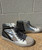 Featuring a bold color-blocked design and a comfy platform sole, these high tops bring streetwear style with a fun, sparkly twist. Perfect with light baggy jeans or black leggings!