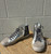 Featuring a bold color-blocked design and a comfy platform sole, these high tops bring streetwear style with a fun, sparkly twist. Perfect with light baggy jeans or black leggings!