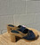 A true throwback piece, these slides feature a denim upper and solid wooden sole for a classic vintage look.
