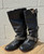 Sleek leather construction meets signature studded hardware for a fierce, moto-inspired silhouette. A true designer statement boot that pairs well with jeans, leggings, or a mini skirt!