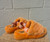 A plush, soft orange upper makes these UGG slides the ultimate comfort shoe. Whether lounging at home or running errands, this cozy statement piece is the perfect addition to your casual rotation!