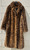 A bold leopard print faux fur maxi coat from designer Dennis Basso. Luxurious texture and eye-catching pattern make this a true statement outerwear piece. Perfect for elevating any winter outfit with a touch of glamour and animal-print edge.