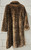 A bold leopard print faux fur maxi coat from designer Dennis Basso. Luxurious texture and eye-catching pattern make this a true statement outerwear piece. Perfect for elevating any winter outfit with a touch of glamour and animal-print edge.