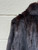A luxurious mahogany fur coat complete with belt and muffler. This rare set offers rich color, exceptional vintage craftsmanship, and old-world elegance from start to finish. A true collector's find for anyone who loves statement vintage outerwear!