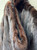 A luxurious mahogany fur coat complete with belt and muffler. This rare set offers rich color, exceptional vintage craftsmanship, and old-world elegance from start to finish. A true collector's find for anyone who loves statement vintage outerwear!