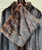 A luxurious mahogany fur coat complete with belt and muffler. This rare set offers rich color, exceptional vintage craftsmanship, and old-world elegance from start to finish. A true collector's find for anyone who loves statement vintage outerwear!