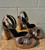 A striking metallic gold and rose gold finish gives these heels serious statement-piece appeal. Sleek and eye-catching, they're the perfect shoe to elevate any outfit, from a night out to a special occasion.