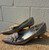 A sleek metallic silver finish gives these classic kitten heels an elegant, versatile edge. Perfect for weddings, office wear, or dressing up your favorite jeans-and-tee combo with a touch of shine.