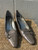 A sleek metallic silver finish gives these classic kitten heels an elegant, versatile edge. Perfect for weddings, office wear, or dressing up your favorite jeans-and-tee combo with a touch of shine.