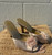 A delicate pale pink hue meets an open-toe, backless silhouette for an airy, romantic feel. A beige-pink flower accent adds a sweet, feminine touch — perfect for weddings, garden parties, or any occasion that calls for soft, ladylike style.