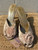 A delicate pale pink hue meets an open-toe, backless silhouette for an airy, romantic feel. A beige-pink flower accent adds a sweet, feminine touch — perfect for weddings, garden parties, or any occasion that calls for soft, ladylike style.