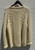 Traditional Aran knitwear at its finest. This 1980s hand-knit wool cardigan features the classic cable-knit patterns Irish knitwear is known for. Warm, timeless, and beautifully crafted, it's a true collector's piece perfect for cozy layering all season long.