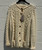 Traditional Aran knitwear at its finest. This 1980s hand-knit wool cardigan features the classic cable-knit patterns Irish knitwear is known for. Warm, timeless, and beautifully crafted, it's a true collector's piece perfect for cozy layering all season long.