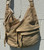 Rich, supple leather in a warm tan hue gives this satchel timeless appeal that only gets better with wear. Structured yet relaxed, it features a spacious interior, sturdy top handles, and clean, understated hardware for a look that's polished without trying too hard. A go-to piece that layers effortlessly into any outfit, season after season.