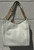 Crisp white leather gives this tote a polished, versatile edge that pairs with absolutely everything. Featuring clean structured lines, sturdy top handles, and signature MK gold-tone hardware, it's roomy enough for work, travel, or daily essentials while staying effortlessly chic. A timeless neutral that never goes out of style.