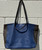 Sleek and sculptural, this tote showcases Furla's iconic Italian craftsmanship with clean lines and a structured silhouette. The convertible handle design offers effortless styling versatility, while the spacious interior keeps you organized for work, travel, or everyday essentials. A polished, timeless piece that elevates any outfit with understated Italian elegance.