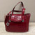 Candy apple red leather handbag by Brighton with bag for storage