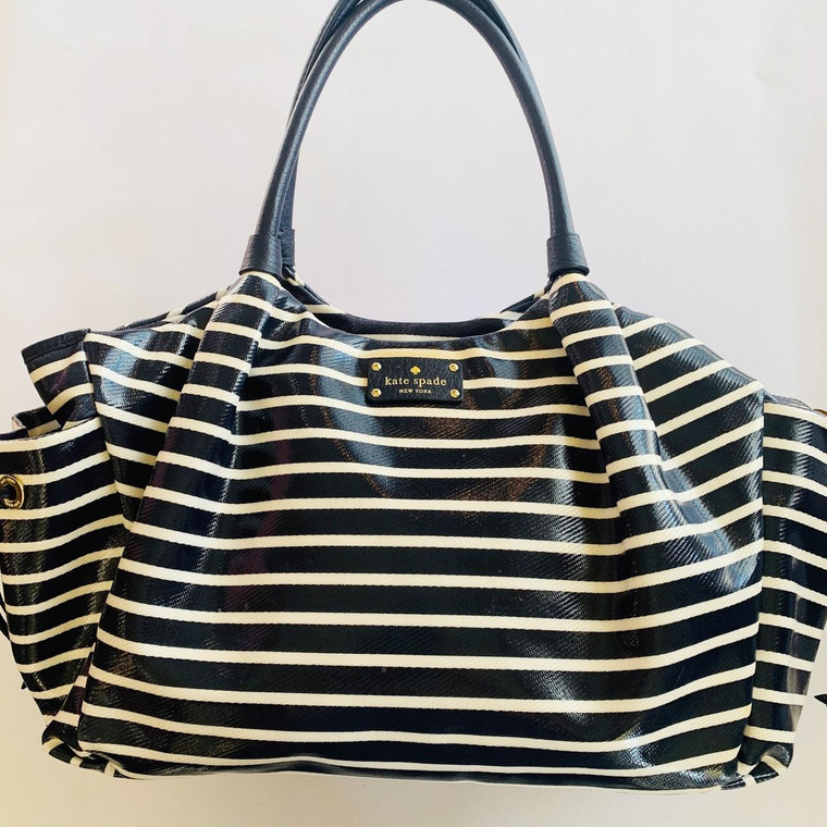 Kate Spade, easy clean nylon Stevie diaper bag retails for dollar420