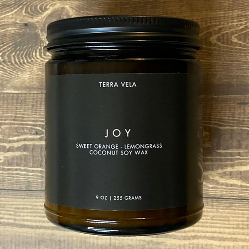 Terra Vela Amber Jar soy wax candle with black lid, burns for up to 50 hours.