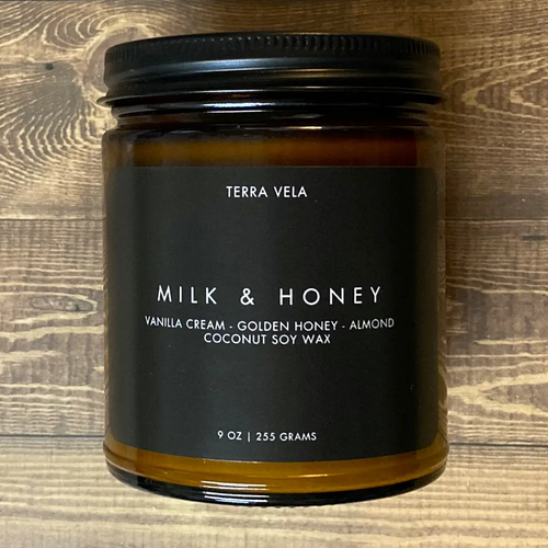 Terra Vela Amber Jar soy wax candle with black lid, burns for up to 50 hours.
