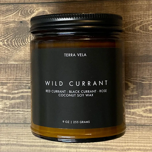 Terra Vela Amber Jar soy wax candle with black lid, burns for up to 50 hours.