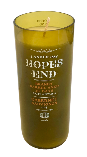 Up-cycled Wine Bottle Candle. Wax content is aprox 18 oz resulting in up to 100 hours burn time.