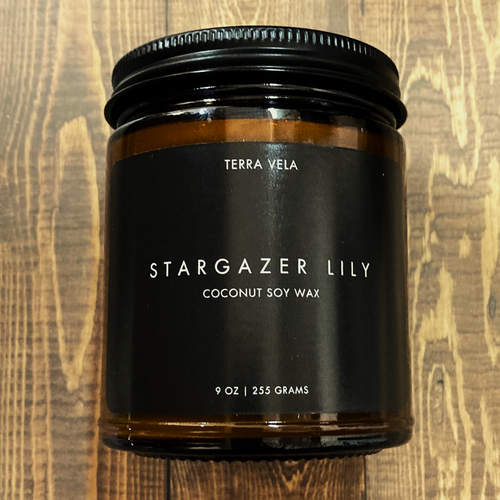 Terra Vela Amber Jar soy wax candle with black lid, burns for up to 50 hours.