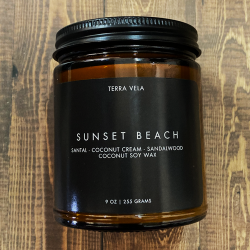 Terra Vela Amber Jar soy wax candle with black lid, burns for up to 50 hours.