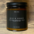Terra Vela Amber Jar soy wax candle with black lid, burns for up to 50 hours.