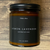 Terra Vela Amber Jar soy wax candle with black lid, burns for up to 50 hours.