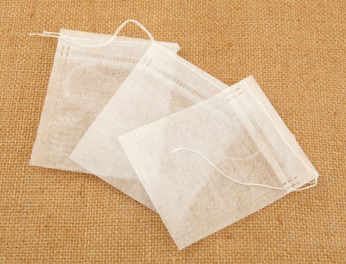 Three corn fibre drawstring empty self fill tea bags