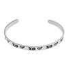 Inspirational stainless steel cuff bracelet with repeating XO's and hearts on the outside and engraved words 'My maid of honor today, my sister forever' on the inside. Adjustable and hypoallergenic, perfect as a thoughtful gift for sisters and symbolizing the bond of sisterhood.