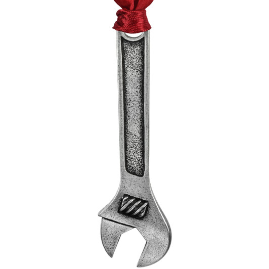 Christmas ornament shaped like a wrench with intricate detailing and ribbon for hanging.