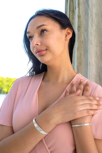 Inspirational stainless steel cuff bracelet with engraved words 'Forever Friends' on the outside. Adjustable and hypoallergenic, perfect as a thoughtful gift for friends.