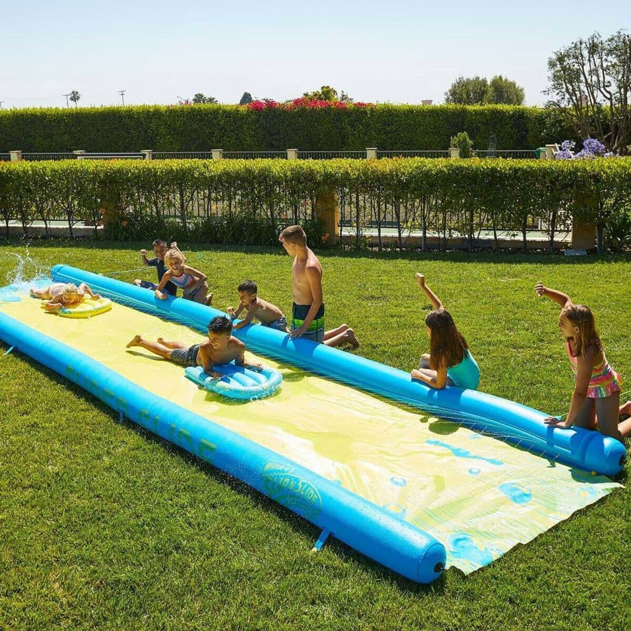 Inflatable slip shop and slide