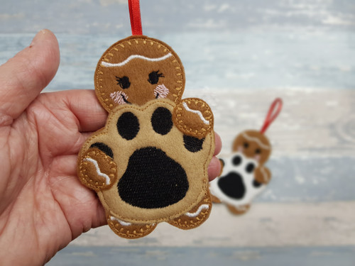 Gingerbread Holding an Animal Paw Print Decoration

Made from layers of felt and embroidered stitching for all the detail.

My cute little gingerbread is holding an Animal Paw Print.

These measure just over 4 inches tall and I have added a brown ribbon so that they can also be hung up.

More gingerbread items can be found here: Gingerbread of all types - A Heartly Craft